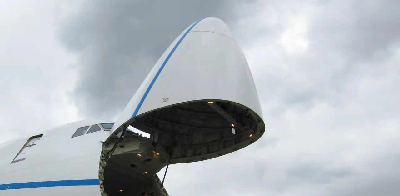 Freighter aircraft with its nose cargo door open
